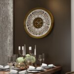 Add a touch of timeless elegance to your living space with this exquisite Round Unique Gold Patina Wall Clock. The intricate frame boasts a royal vintage effect, creating a luxurious atmosphere in any room. The mirrored design adds a touch of glamour, while the boho style clock enhances the overall aesthetic. Perfect for a chic living room, bedroom, or office, this stunning piece of wall art effortlessly combines style and functionality. Make a statement with this one-of-a-kind wall clock that will surely elevate your decor.