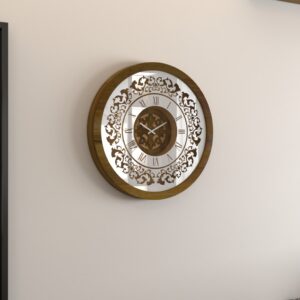 Add a touch of timeless elegance to your living space with this exquisite Round Unique Gold Patina Wall Clock. The intricate frame boasts a royal vintage effect, creating a luxurious atmosphere in any room. The mirrored design adds a touch of glamour, while the boho style clock enhances the overall aesthetic. Perfect for a chic living room, bedroom, or office, this stunning piece of wall art effortlessly combines style and functionality. Make a statement with this one-of-a-kind wall clock that will surely elevate your decor.