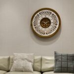 Add a touch of timeless elegance to your living space with this exquisite Round Unique Gold Patina Wall Clock. The intricate frame boasts a royal vintage effect, creating a luxurious atmosphere in any room. The mirrored design adds a touch of glamour, while the boho style clock enhances the overall aesthetic. Perfect for a chic living room, bedroom, or office, this stunning piece of wall art effortlessly combines style and functionality. Make a statement with this one-of-a-kind wall clock that will surely elevate your decor.