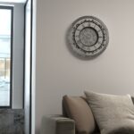 Introducing our stunning Roman Numeral Wall Clock, the perfect addition to your living room decor! This unique wall art piece features a chic vintage look with a round design in a beautiful silver patina finish. Elegant and timeless, this clock will make a statement in any room it's placed in. Elevate your space with this exquisite piece that combines functionality with style. Perfect for adding a touch of sophistication to your home, this Roman Numeral Wall Clock is sure to impress your guests and become a focal point in your space. Make a stylish statement with this elegant wall clock today!