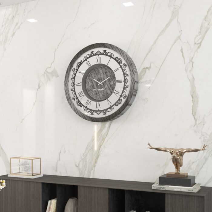 Introducing our stunning Roman Numeral Wall Clock, the perfect addition to your living room decor! This unique wall art piece features a chic vintage look with a round design in a beautiful silver patina finish. Elegant and timeless, this clock will make a statement in any room it's placed in. Elevate your space with this exquisite piece that combines functionality with style. Perfect for adding a touch of sophistication to your home, this Roman Numeral Wall Clock is sure to impress your guests and become a focal point in your space. Make a stylish statement with this elegant wall clock today!