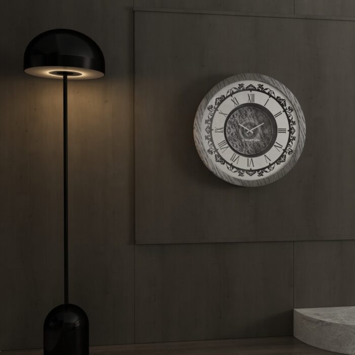 Add a touch of timeless elegance to your living room with this Roman Numeral Wall Clock. This unique wall art piece boasts a chic vintage look with its round design and silver patina finish. Its sophisticated appeal makes it the perfect addition to any stylish space, adding an elegant touch to your decor. Make a statement in your living room with this exquisite clock that is sure to impress your guests and elevate your room decor.