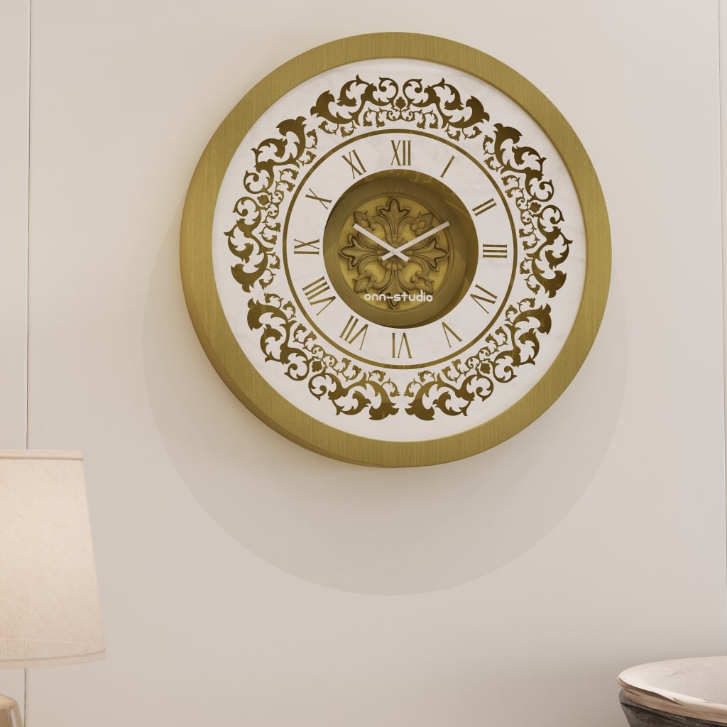 Add a touch of vintage charm to your home or office with this exquisite Vintage Floral Bronze Effect Wall Clock. Featuring elegant Roman numerals on a large round mirror, this artisan timekeeper is a statement piece that will elevate any space. Handmade with care, this wooden clock is perfect for adding a touch of sophistication to your living room decor. Make a statement with this elegant wall clock that combines beauty and functionality in one stunning piece.