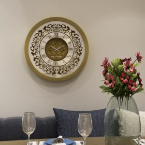 Add a touch of vintage charm to your home or office with this exquisite Vintage Floral Bronze Effect Wall Clock. Featuring elegant Roman numerals on a large round mirror, this artisan timekeeper is a statement piece that will elevate any space. Handmade with care, this wooden clock is perfect for adding a touch of sophistication to your living room decor. Make a statement with this elegant wall clock that combines beauty and functionality in one stunning piece.