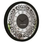 Add a touch of timeless elegance to your living space with our Round Black Color Designer Wall Clock. This exquisite clock features Roman numerals and a vintage artisan design, making it the perfect statement piece for your home decor. Crafted with precision and attention to detail, this large wall clock exudes luxury and charm. The rhinestone sparkling crystal detail adds a touch of glamour and sophistication, while the silent operation ensures a peaceful ambiance in any room. This decorative mirrored clock is a must-have for those who appreciate aesthetic design and vintage-inspired accents. Surprise your loved ones with this handmade wall clock as a housewarming gift that will elevate their interior design. Embrace the beauty of this unique wall clock that doubles as boho wall art and rhinestone decor, bringing a touch of classic luxury to your living space. Elevate your home with this stunning piece of luxury classic home accessories.