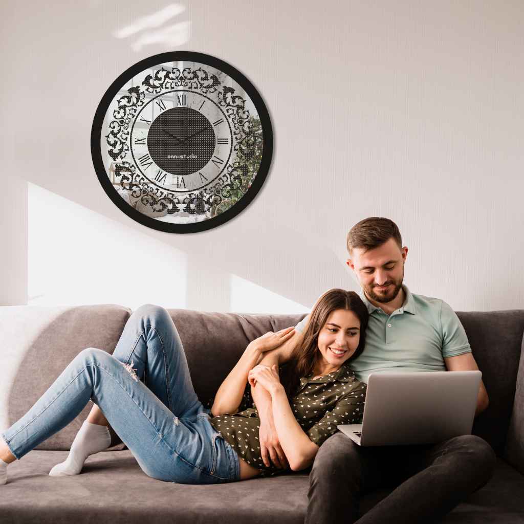 Round black diamond rhinestone wall clock hanging above cute couple.