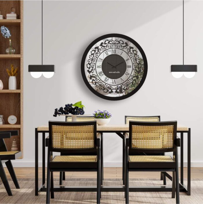 Add a touch of timeless elegance to your living space with our Round Black Color Designer Wall Clock. This exquisite clock features Roman numerals and a vintage artisan design, making it the perfect statement piece for your home decor. Crafted with precision and attention to detail, this large wall clock exudes luxury and charm. The rhinestone sparkling crystal detail adds a touch of glamour and sophistication, while the silent operation ensures a peaceful ambiance in any room. This decorative mirrored clock is a must-have for those who appreciate aesthetic design and vintage-inspired accents. Surprise your loved ones with this handmade wall clock as a housewarming gift that will elevate their interior design. Embrace the beauty of this unique wall clock that doubles as boho wall art and rhinestone decor, bringing a touch of classic luxury to your living space. Elevate your home with this stunning piece of luxury classic home accessories.