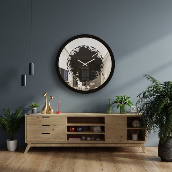 Round black Persian calligraphy mirrored wall clock hanging in grey room.