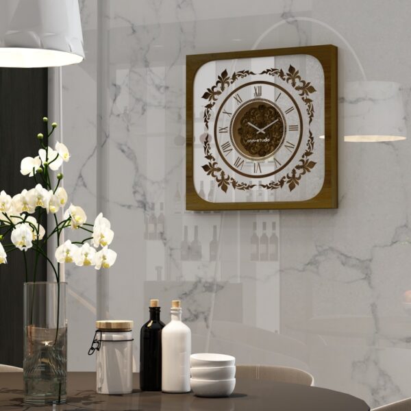 Add a touch of Boho style charm to your living space with this unique Roman Numeral Mirror Clock. This chic vintage square wall clock in patina gold is not just a timepiece, but a piece of elegant home decor that will elevate the look of your living room. With its intricate Roman numerals and stylish design, this clock is sure to be a conversation starter and a focal point in any room. Bring a touch of sophistication and vintage flair to your home with this stunning wall art piece.