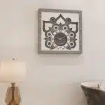 Introducing our Roman Numeral Wall Clock - a unique piece of wall art perfect for living rooms! This chic vintage look square wall clock features a stunning silver patina finish, adding an elegant touch to your living room decor. It serves as a statement piece that enhances any room decor with its chic and stylish design. Elevate your space with this sophisticated and timeless addition that exudes charm and character. Perfect for adding a touch of elegance to your home, this Roman Numeral Wall Clock is sure to become a beloved element of your chic home decor collection.