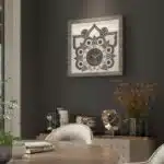 Introducing our exquisite Roman Numeral Wall Clock, the perfect statement piece for your living room decor. This chic vintage-inspired square wall clock in a stunning silver patina finish exudes elegance and sophistication. Its unique design adds a touch of luxury to any space, making it a must-have for those who appreciate chic home decor. Upgrade your living room with this stylish yet functional wall art that is sure to impress guests and elevate the ambiance of your home.