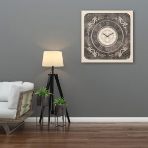 Square shell patina mirrored wall clock hanging in grey living room.