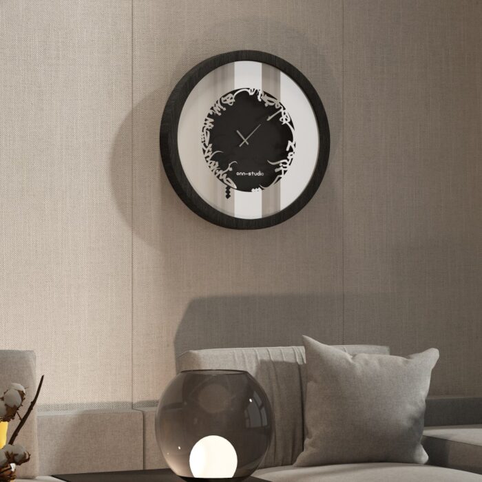 Add a touch of elegance to your space with this traditional round-shaped handmade wall clock adorned with 5 stunning surrounding colors - black, gray, gold, beige, and walnut. The captivating design feature of this piece is the intricate Persian calligraphy encircling the mirrored clock, creating a stylish one-of-a-kind look that shines beautifully on any wall. This large modern wall clock is not only a functional timepiece but also a stunning piece of art. With its oversized silhouette and silent mechanism, it is perfect for adding a bold statement to your kitchen or any room in your home. Make a stylish statement with this unique and eye-catching timepiece.