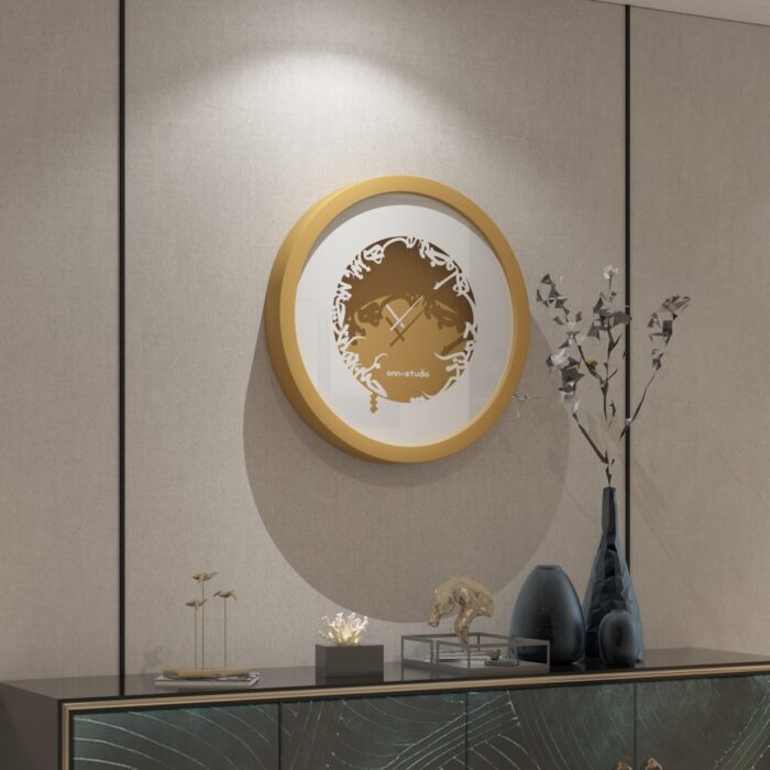 Add a touch of elegance to your space with this traditional round-shaped handmade wall clock adorned with 5 stunning surrounding colors - black, gray, gold, beige, and walnut. The captivating design feature of this piece is the intricate Persian calligraphy encircling the mirrored clock, creating a stylish one-of-a-kind look that shines beautifully on any wall. This large modern wall clock is not only a functional timepiece but also a stunning piece of art. With its oversized silhouette and silent mechanism, it is perfect for adding a bold statement to your kitchen or any room in your home. Make a stylish statement with this unique and eye-catching timepiece.