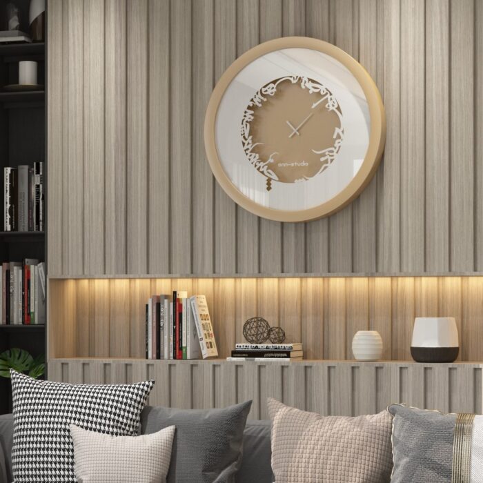 Add a touch of elegance to your space with this traditional round-shaped handmade wall clock adorned with 5 stunning surrounding colors - black, gray, gold, beige, and walnut. The captivating design feature of this piece is the intricate Persian calligraphy encircling the mirrored clock, creating a stylish one-of-a-kind look that shines beautifully on any wall. This large modern wall clock is not only a functional timepiece but also a stunning piece of art. With its oversized silhouette and silent mechanism, it is perfect for adding a bold statement to your kitchen or any room in your home. Make a stylish statement with this unique and eye-catching timepiece.