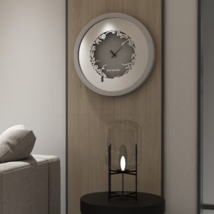 Add a touch of elegance to your space with this traditional round-shaped handmade wall clock adorned with 5 stunning surrounding colors - black, gray, gold, beige, and walnut. The captivating design feature of this piece is the intricate Persian calligraphy encircling the mirrored clock, creating a stylish one-of-a-kind look that shines beautifully on any wall. This large modern wall clock is not only a functional timepiece but also a stunning piece of art. With its oversized silhouette and silent mechanism, it is perfect for adding a bold statement to your kitchen or any room in your home. Make a stylish statement with this unique and eye-catching timepiece.