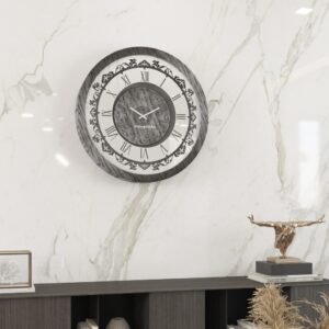 Introducing our stunning Roman Numeral Wall Clock, the perfect addition to your living room decor! This unique wall art piece features a chic vintage look with a round design in a beautiful silver patina finish. Elegant and timeless, this clock will make a statement in any room it's placed in. Elevate your space with this exquisite piece that combines functionality with style. Perfect for adding a touch of sophistication to your home, this Roman Numeral Wall Clock is sure to impress your guests and become a focal point in your space. Make a stylish statement with this elegant wall clock today!