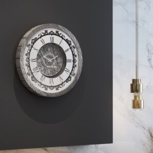 Introducing our stunning Roman Numeral Wall Clock, the perfect addition to your living room decor! This unique wall art piece features a chic vintage look with a round design in a beautiful silver patina finish. Elegant and timeless, this clock will make a statement in any room it's placed in. Elevate your space with this exquisite piece that combines functionality with style. Perfect for adding a touch of sophistication to your home, this Roman Numeral Wall Clock is sure to impress your guests and become a focal point in your space. Make a stylish statement with this elegant wall clock today!