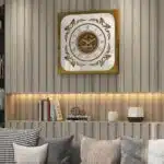 Add a touch of Boho style charm to your living space with this unique Roman Numeral Mirror Clock. This chic vintage square wall clock in patina gold is not just a timepiece, but a piece of elegant home decor that will elevate the look of your living room. With its intricate Roman numerals and stylish design, this clock is sure to be a conversation starter and a focal point in any room. Bring a touch of sophistication and vintage flair to your home with this stunning wall art piece.