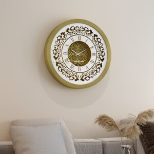 Add a touch of timeless elegance to your home or office with this stunning Vintage Floral Bronze Effect Wall Clock. Featuring classic Roman numerals on a large round mirror, this artisan timekeeper is sure to make a statement in any room. Handmade with care, this elegant wall clock is the perfect addition to your living room decor or as a centerpiece for your space. Crafted from high-quality wood, this unique clock is both functional and stylish, making it a beautiful and practical accent piece for your home. Elevate your interior with this exquisite handmade clock today!