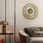 Add a touch of timeless elegance to your home or office with this stunning Vintage Floral Bronze Effect Wall Clock. Featuring classic Roman numerals on a large round mirror, this artisan timekeeper is sure to make a statement in any room. Handmade with care, this elegant wall clock is the perfect addition to your living room decor or as a centerpiece for your space. Crafted from high-quality wood, this unique clock is both functional and stylish, making it a beautiful and practical accent piece for your home. Elevate your interior with this exquisite handmade clock today!