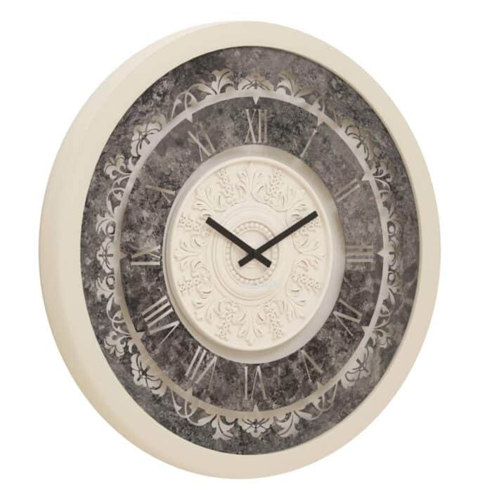 Add a touch of timeless elegance to your living space with our Round Beige Colour Wall Clocks. This Vintage Clock features Roman Numerals and a Traditional Floral design that will elevate any room's decor. Handcrafted by skilled artisans, this Large wall clock makes for a stunning statement piece in any home. Its silent operation ensures a peaceful ambiance while its Decorative Mirrored finish adds a touch of sophistication. The Aesthetic design of this Unique wall clock blends seamlessly with both traditional and modern interior styles, making it the perfect Housewarming gift or addition to your own collection. Embrace a touch of Retro design and Boho Wall Art with this Handmade wall clock that exudes charm and character. Upgrade your Interior Design with this one-of-a-kind clock that will instantly enhance your room decor.