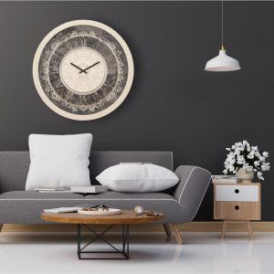 Round shell patina mirrored wall clock hanging in grey living room.
