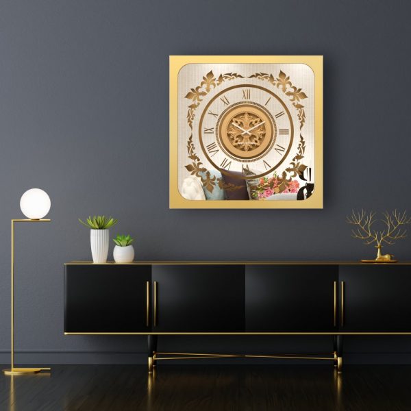 Square gold mirrored wall clock hanging in a black and gold room.