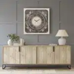 Add a touch of elegance to your living space with our Square Beige Colour Wall Clock featuring Roman Numerals and a Traditional Floral design. This Artisan clock is a true statement piece, handcrafted with care to bring a vintage charm to your home. Its large size and silent movement make it perfect for any room decor, while the Decorative Mirrored accents add a unique touch to this clock. Whether you are looking for an interior design upgrade or a thoughtful housewarming gift, this beautiful piece is sure to impress. Embrace the Boho Wall Art trend with this Retro-inspired clock, creating an aesthetic design that will enhance any space. Don't miss out on this opportunity to add a one-of-a-kind, Handmade Wall Clock to your collection!