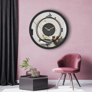 Round black Persian calligraphy mirrored wall clock hanging in pink room.