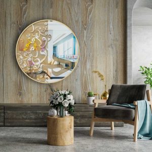 Oversized round gold mirror with Persian calligraphy hanging in cosy room.