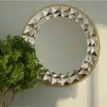 Add a touch of sophistication and style to your space with this stunning Round Large Gold Mirror. Perfect for elevating your Aesthetic Living Room Decor or enhancing your Bathroom Vanity, this versatile piece is a must-have for any room. The unique design of this mirror makes it a standout piece of Room Decor, while the Sunburst detailing adds a touch of elegance. Whether you hang it in your entryway for a Unique Entryway Mirror or use it as Boho Wall Art, this mirror is sure to make a statement in your home.