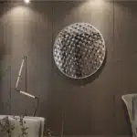 Elevate your space with this Unique Decorative Round Mirror, a stunning addition to your living room décor or bathroom vanity. Handmade with exquisite craftsmanship using high-quality wood, this mirror exudes an aesthetic design that will beautifully complement any interior style. Its eye-catching circular shape makes it a statement piece, perfect for adding a touch of elegance to your walls. Whether used as a wall accent or room decor, this mirror is sure to enhance your interior design with its timeless appeal.