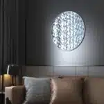 Introduce a touch of elegance and style to your living space with this Unique Decorative Round Mirror. Perfect for enhancing your living room décor or adding a chic accent to your bathroom vanity, this handmade wood mirror is a true statement piece. The intricate design and aesthetic appeal make it a standout choice for any interior design style. Whether used as a wall accent or as part of your room decor, this mirror is sure to add charm and sophistication to your home. Elevate your space with this stunning piece of art that is not only functional but also adds a touch of luxury to your surroundings.