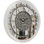 A wall-mounted clock displaying the time, featuring a classic design and clear numerals for easy readability.