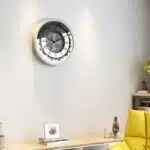 Add a touch of vintage charm to your living space with this stunning Silver Color Round Wall Clock. Featuring elegant Roman Numerals, a Curved Wood Center, and an Antique finish, this Large Wall Clock is perfect for adding a unique touch to your kitchen or living room decor. Whether you need a statement piece with this Oversized Wall Clock or a simple timepiece with this Silent Wall Clock, this Retro-inspired design is sure to impress. Don't miss out on this must-have item for anyone seeking a blend of classic and contemporary style!