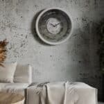 A wall-mounted clock displaying the time, featuring a classic design and clear numerals for easy readability.