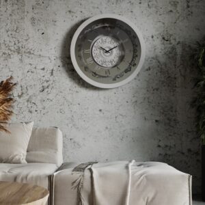 A wall-mounted clock displaying the time, featuring a classic design and clear numerals for easy readability.