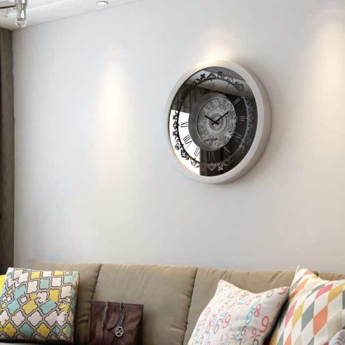 A wall-mounted clock displaying the time, featuring a classic design and clear numerals for easy readability.