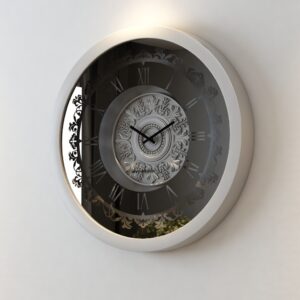 A wall-mounted clock displaying the time, featuring a classic design and clear numerals for easy readability.