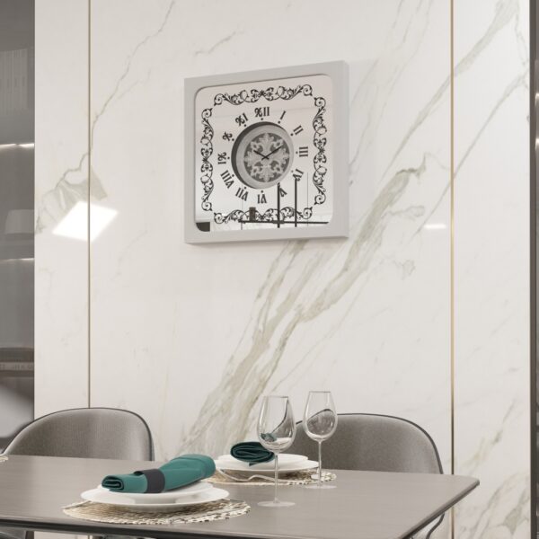 Square oversized wall clock with a silver wooden frame, mirrored glass face, Roman numerals, and floral wood center.