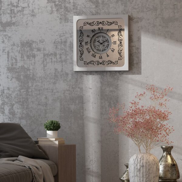 Square oversized wall clock with a silver wooden frame, mirrored glass face, Roman numerals, and floral wood center.