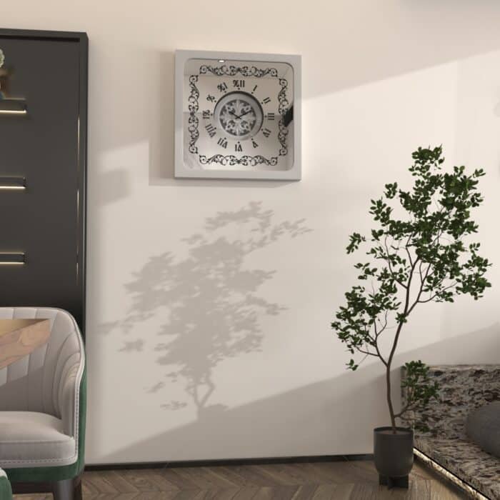 Square oversized wall clock with a silver wooden frame, mirrored glass face, Roman numerals, and floral wood center.