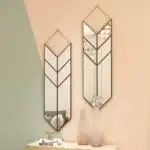 Elevate your home decor with this striking Arrow Shape Mirror. Perfect for adding a touch of elegance to your living room or bathroom, this unique wall mirror is designed to stand out with its asymmetrical irregular shape. This modern stylish minimal mirror doubles as a chic piece of wall art, making it a must-have for any sophisticated home. Make a bold statement with this one-of-a-kind piece that will surely leave a lasting impression on your guests.