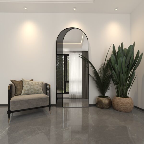 Add a touch of contemporary elegance to your living space with this Modern Arched Floor Mirror. This full-length lean wall mirror features an asymmetrical design, perfect for adding a chic flair to your housewarming decor. Use it as a leaner mirror in your bedroom or living room to create the illusion of a larger space while adding a stylish statement piece. Elevate your home decor with this stunning and sleek large mirror that will instantly upgrade any room in your house.