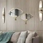 Add a touch of modern elegance to your living room with this unique asymmetrical mirror. This irregular fan-shaped mirror is the perfect addition to any space, whether used as a statement piece or as a functional bathroom vanity mirror. The combination of large and small mirrors creates a visually stunning design that will instantly elevate your home decor. Give the gift of style with this one-of-a-kind mirror, a perfect housewarming present for anyone who appreciates a contemporary and minimal aesthetic.