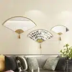 Add a touch of modern elegance to your living room with this unique asymmetrical mirror. This irregular fan-shaped mirror is the perfect addition to any space, whether used as a statement piece or as a functional bathroom vanity mirror. The combination of large and small mirrors creates a visually stunning design that will instantly elevate your home decor. Give the gift of style with this one-of-a-kind mirror, a perfect housewarming present for anyone who appreciates a contemporary and minimal aesthetic.