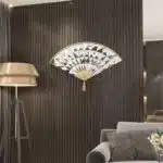 Add a touch of modern elegance to your living room with this unique asymmetrical mirror. This irregular fan-shaped mirror is the perfect addition to any space, whether used as a statement piece or as a functional bathroom vanity mirror. The combination of large and small mirrors creates a visually stunning design that will instantly elevate your home decor. Give the gift of style with this one-of-a-kind mirror, a perfect housewarming present for anyone who appreciates a contemporary and minimal aesthetic.