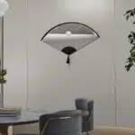 Add a touch of modern elegance to your living space with this stunning Asymmetrical Mirror for Living Room Décor. This unique irregular mirror is perfect for adding a contemporary flair to any room and makes a wonderful housewarming gift. Its fan shape design exudes a modern and minimalistic vibe, while the option of choosing between a large and small size ensures a perfect fit for your space. Whether you place it above a bathroom vanity or in the entryway, this mirror is sure to elevate the style of your home décor.