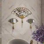 Add a touch of modern elegance to your living room décor with this unique asymmetrical mirror. Perfect for adding a contemporary flair to any space, this irregular fan-shaped mirror is both stylish and functional. Whether it's hanging in the bathroom as a vanity mirror or displayed in the living room as a statement piece, this mirror is sure to impress. Available in both large and small sizes, it also makes a thoughtful housewarming gift for your loved ones. Upgrade your home with this modern and minimalistic mirror today!